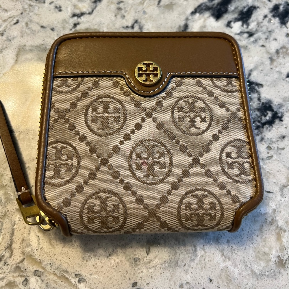 Tory Burch T Monogram bi-fold zip wallet.